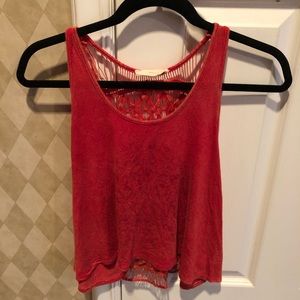 red tank top with design on front and string back